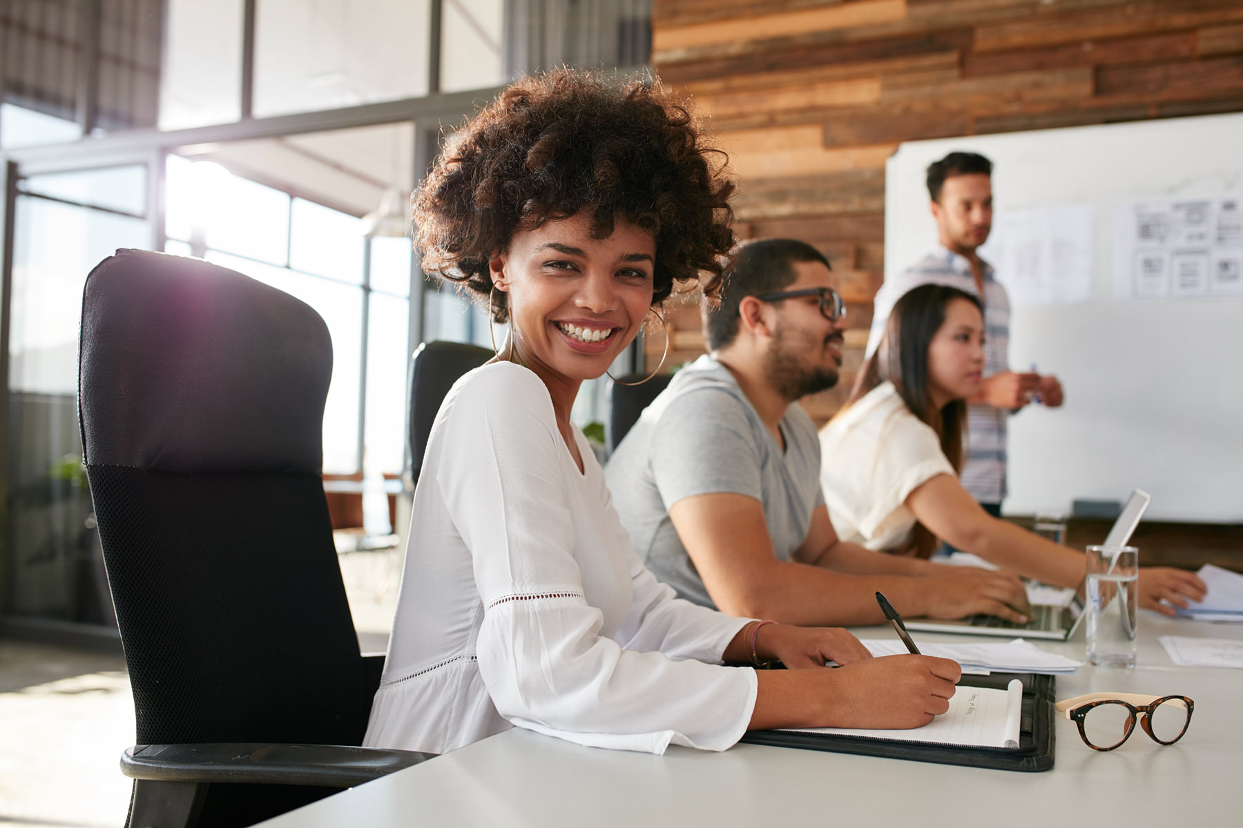 woman looking at camera in a meeting