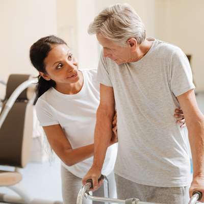 patient performing physical therapy with a nurse